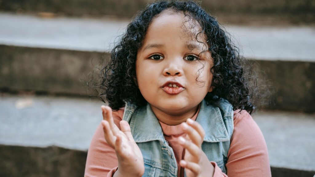 a child speaking; SoundEd Therapy for speech and language