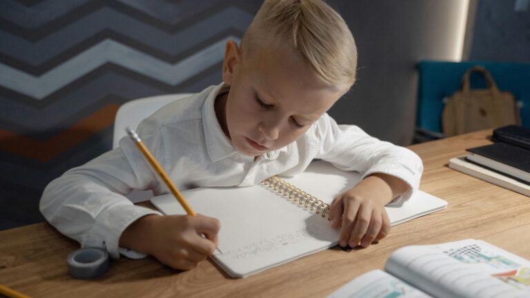 A homeschooled child in arkansas doing school work; Sounded Therapy for homeschooling