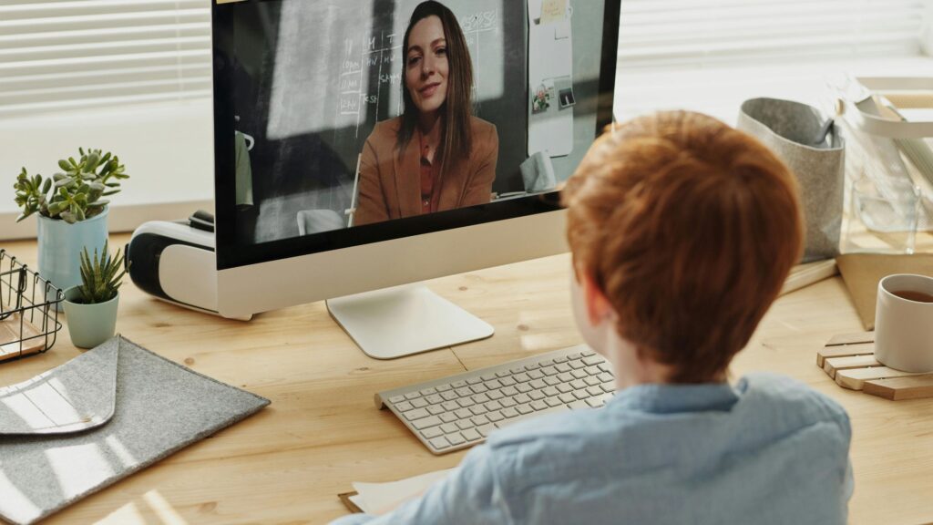 A child attending school-based teletherapy; SoundEd Therapy for schools