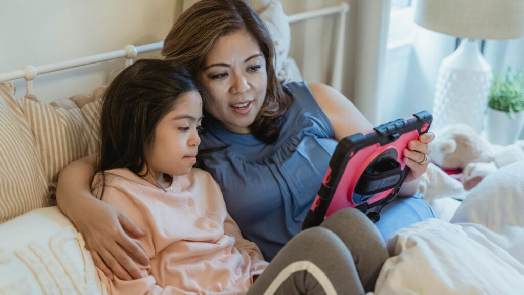 A mother and daughter receiving teletherapy support; SoundEd therapy for IEP timelines