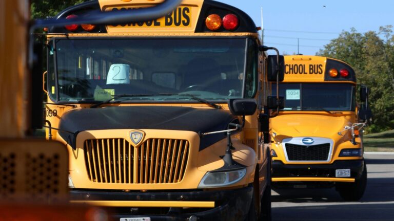 Empty yellow school buses depicting effects of staffing transitions; SoundEd therapy