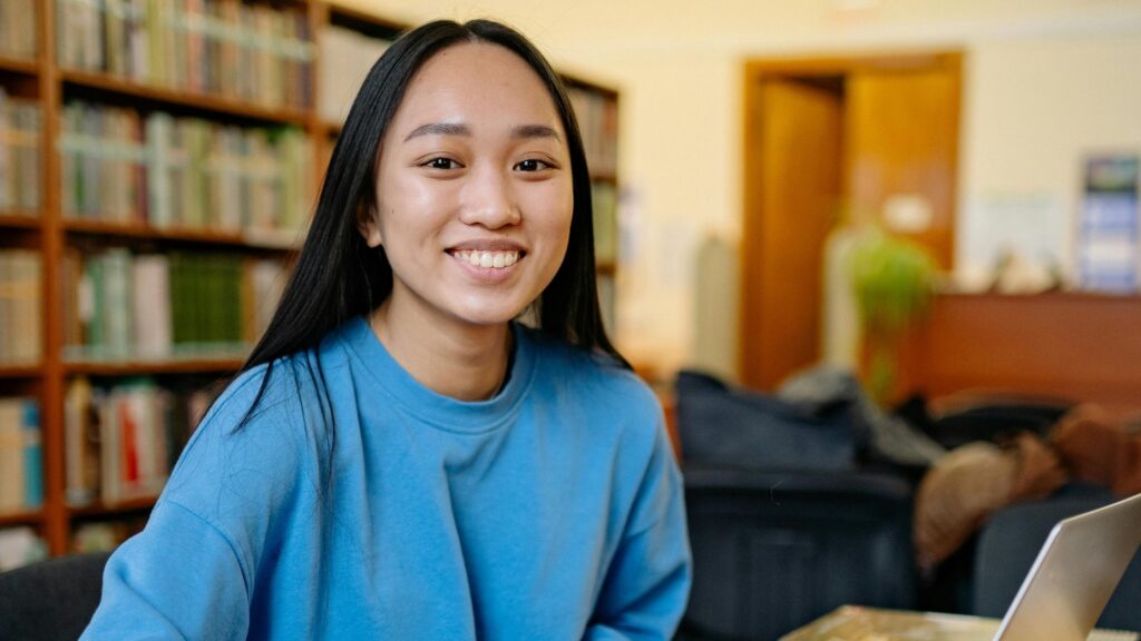 A student in school library; SoundEd therapy onboarding teletherapy in schools