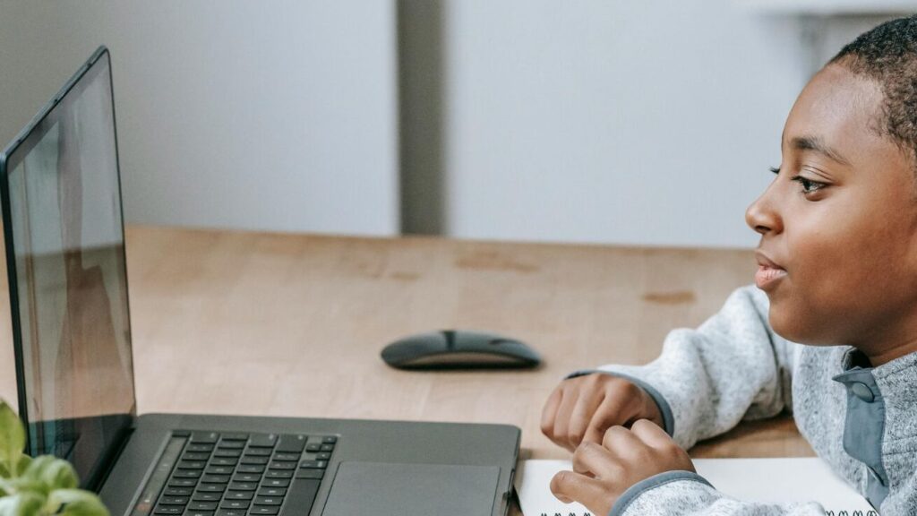 A boy using teletherapy in k12 education; SoundEd therapy
