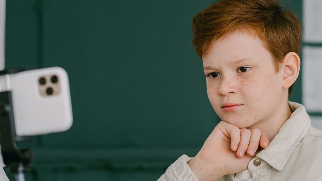 A student posing for a picture in school; SoundEd therapy teletherapy in k12 education